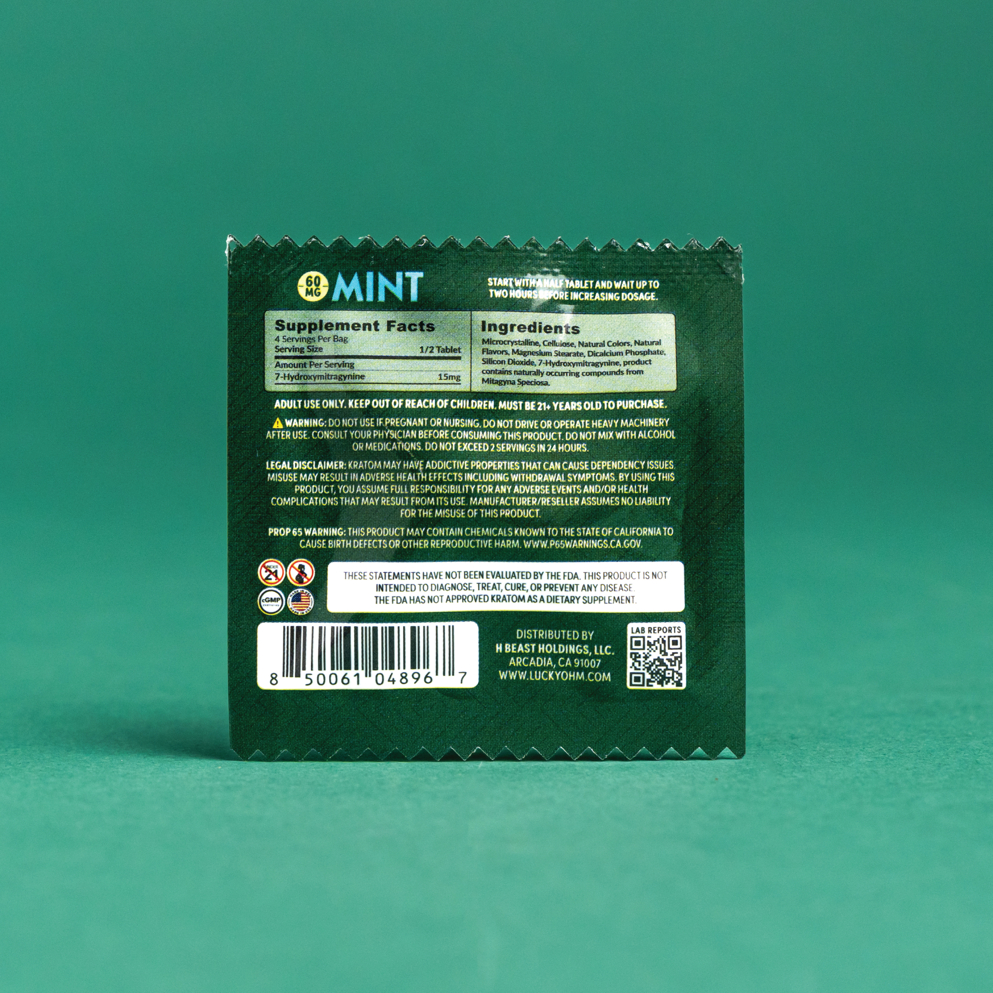 Green packaging with text and barcodes on a teal background